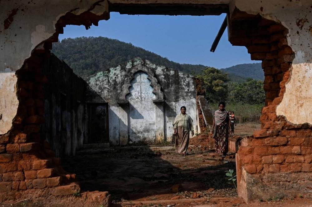 Christian villagers walk inside a church on Feb. 28, 16 years after it was destroyed by a mob following the murder of a Hindu priest, in the village of Irpiguda in the Kandhamal district of India's Odisha state. With India's election on the horizon and Hindu nationalist Prime Minister Narendra Modi widely expected to win, many Christians fear they may once again become targets.