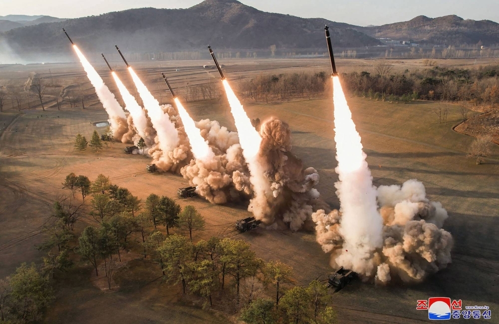 This picture taken on March 18 and released by North Korea's official Korean Central News Agency is said to show an ultralarge rocket salvo firing drill by North Korea.