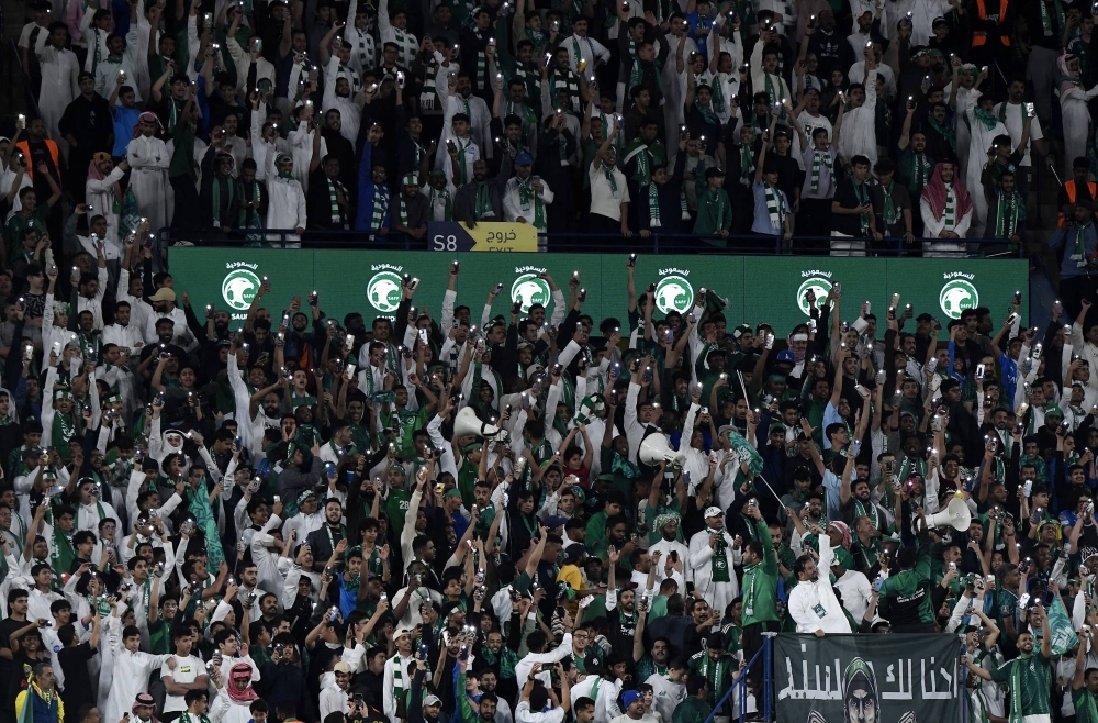 Saudi Arabia fans cheer on the national team during a World Cup qualifying match in Riyadh on March 21. 