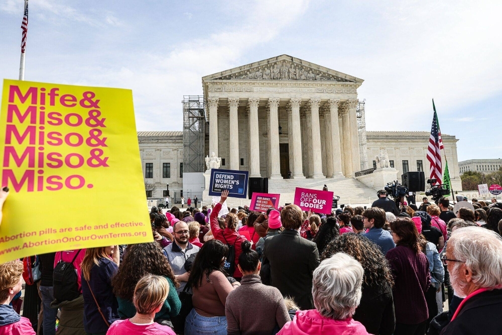Demonstrators on Tuesday in Washington, where the U.S. Supreme Court signaled it's likely to preserve full access to a widely used abortion pill as the justices heard arguments in a case carrying major stakes for reproductive rights and potentially this year's elections.