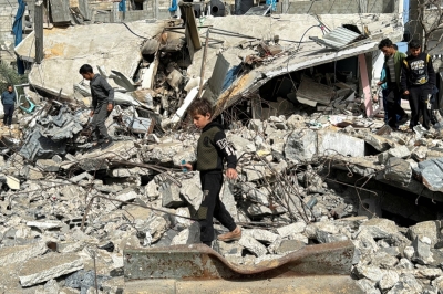 A Palestinian boy walks on the site of an Israeli strike in Rafah, in the southern Gaza Strip, on March 27.