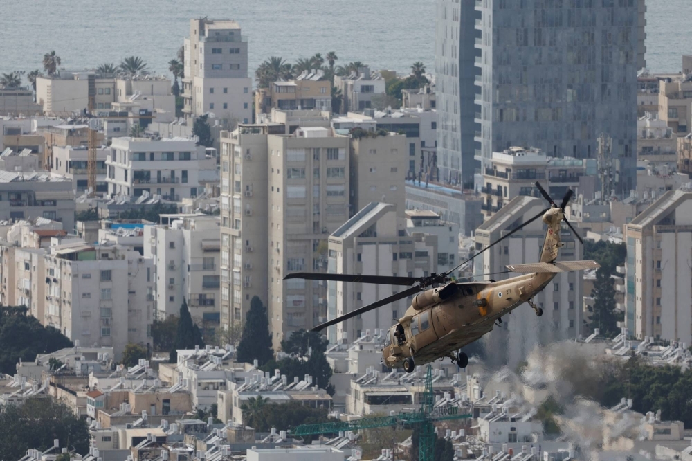 An Israeli military helicopter flying away from the helipad of a hospitalin Tel Aviv, Israel, after transporting a patient on Tuesday.