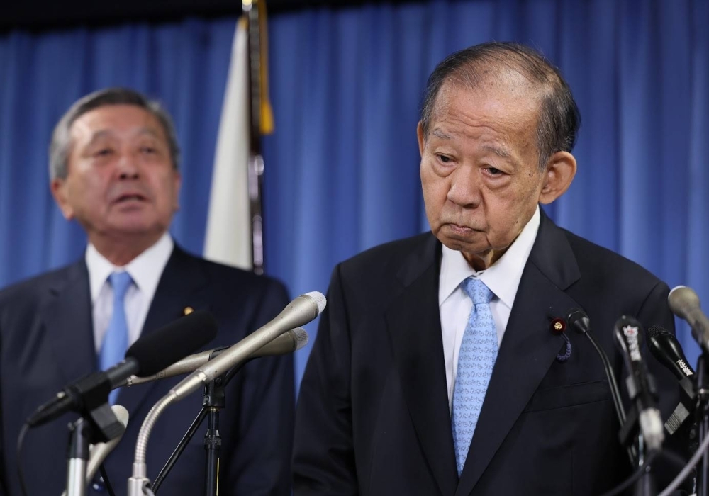 Liberal Democratic Party heavyweight Toshihiro Nikai addresses a news conference Monday after he announced that he will not run in the next general election amid the political funds scandal engulfing his party.