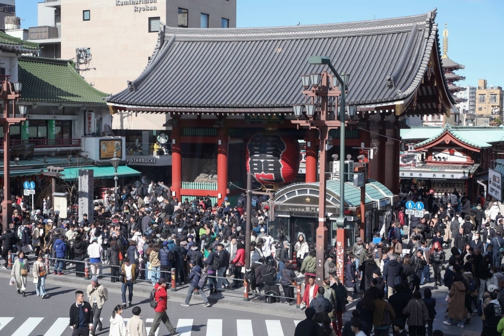 Tourists crowd Sensoji Temple in Tokyo's Asakusa district in February. 