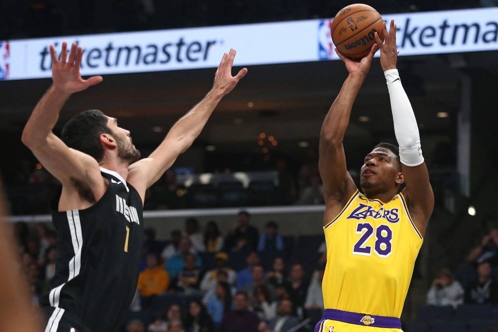 Los Angeles Lakers forward Rui Hachimura shoots as Memphis Grizzlies forward-center Santi Aldama defends during a game at FedExForum in Memphis, Tennessee, on Wednesday.