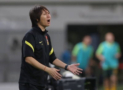 China coach Li Tie reacts during a soccer match between China and Australia in Qatar in September 2021.