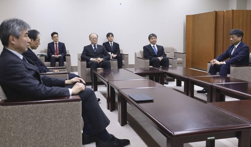 Officials from the Finance Ministry, the Bank of Japan and the Financial Services Agency hold an emergency meeting over the yen at the ministry on Wednesday.