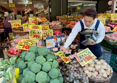 A man works at a supermarket in Tokyo last month. Price increases backed by higher ingredient costs have started to come back due to unstable weather, Teikoku Databank has said.