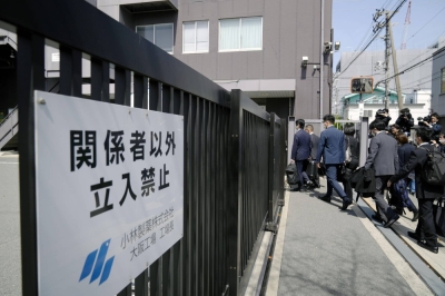 Health ministry officials and local authorities inspect a Kobayashi Pharmaceutical factory in Osaka on Saturday following reports of deaths and hospitalizations possibly linked to its red yeast rice dietary supplements.