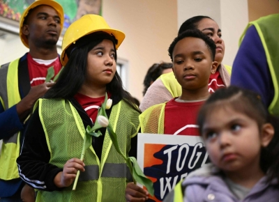 Baltimore workers and relatives attend a news conference to honor families and victims of last week's collapse of the Francis Scott Key Bridge after it was struck by the container ship Dali, in Baltimore, Maryland, on Friday. The death of six Latino workers who were fixing potholes when a Baltimore bridge collapsed highlights the crucial role immigrants play in keeping America running, say advocates. 