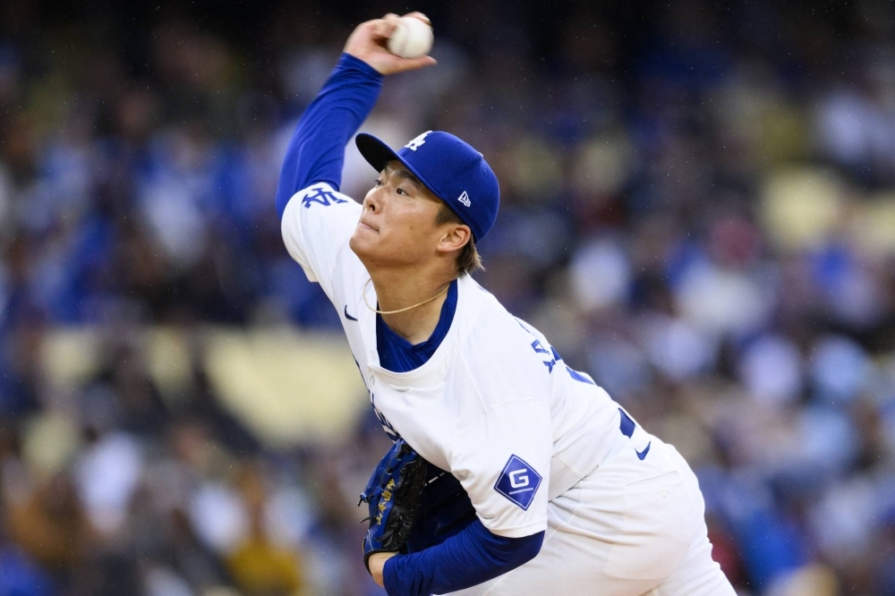 Dodgers starting pitcher Yoshinobu Yamamoto delivers a pitch during the first inning against the Cardinals on Saturday at Dodger Stadium. 