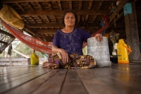 Sat Sinri used to spend hours hauling unfiltered water from the Mekong River to her home in Inn Chey in Cambodia’s Kratie Province with a re-used five-gallon paint bucket. That chore is now unneeded thanks to the village's new water system. | Anton L. Delgado
