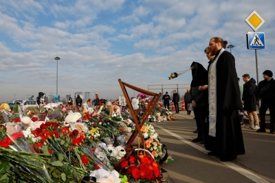 Clergymen conduct a memorial service for victims at a makeshift memorial near the Crocus City Hall following a deadly attack on the concert venue outside Moscow on Friday.