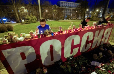 People attend a vigil in memory of the victims of a shooting attack at the Crocus City Hall concert venue outside Moscow, in Donetsk, Russian-controlled Ukraine, on Saturday. 