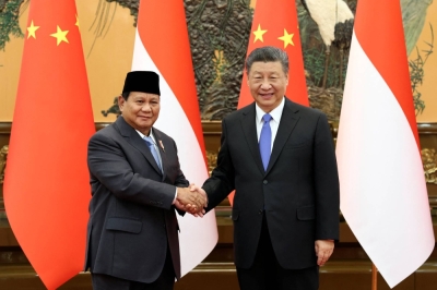 Chinese leader Xi Jinping and Indonesian President-elect Prabowo Subianto shake hands at the Great Hall of the People in Beijing on Monday.