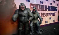 People dressed as King Kong and Godzilla attend the world premiere of "Godzilla x Kong: The New Empire" at the TCL Chinese Theater in Hollywood last month.  | AFP-JIJI