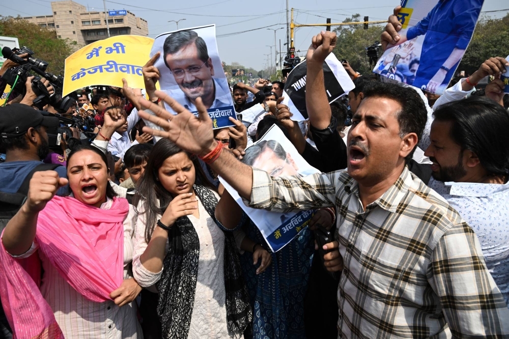 Demonstrators protest against the arrest of Delhi Chief Minister Arvind Kejriwal, in Delhi on March 22.