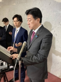 Defense Minister Minoru Kihara speaks to reporters at the parliamentary building on Tuesday. | Jiji