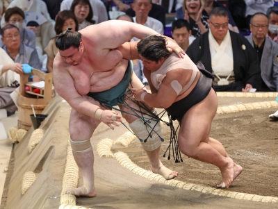 Hakuoho (right) shoves out Aoiyama during the Nagoya Basho in July last year. The promising young wrestler is now part of Terunofuji's Isegahama stable after the Miyagino stable was forced to close following a bullying scandal. 