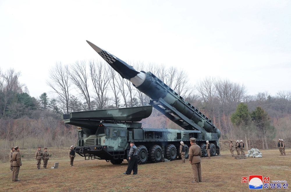 North Korean leader Kim Jong Un inspects the first test-fire of the Hwasong-16B, a new-type intermediate-range, solid-fueled ballistic missile outside Pyongyang in this image released Wednesday. 