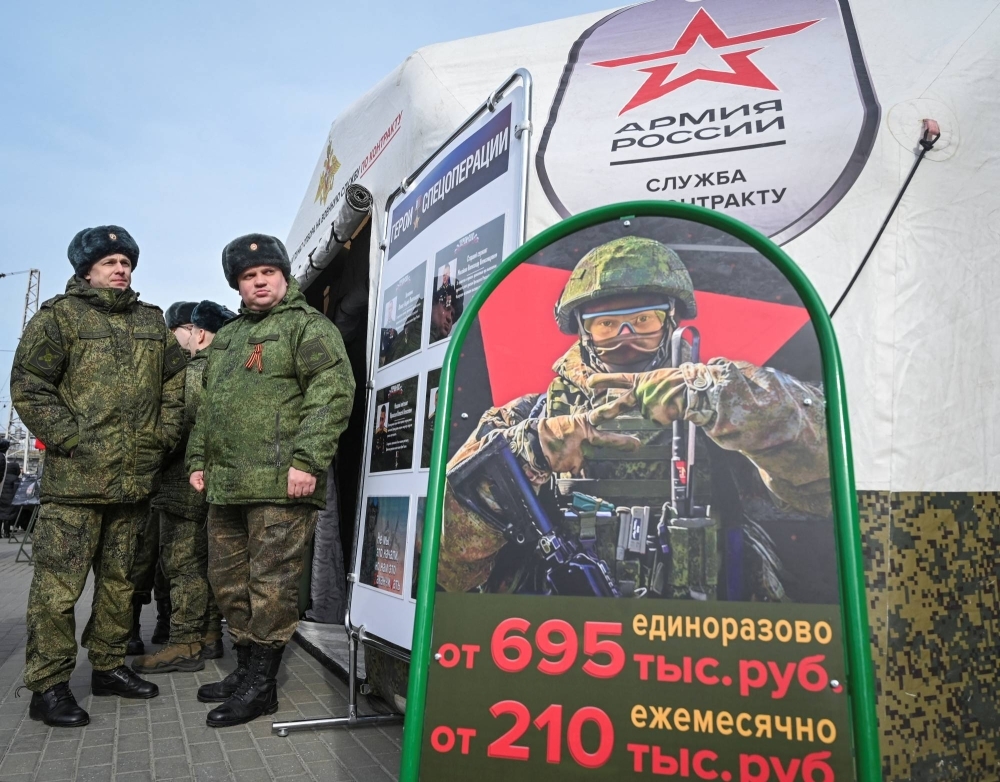 Russian Army servicemen stand near a mobile recruiting center in Rostov-on-Don, Russia, on Wednesday. 