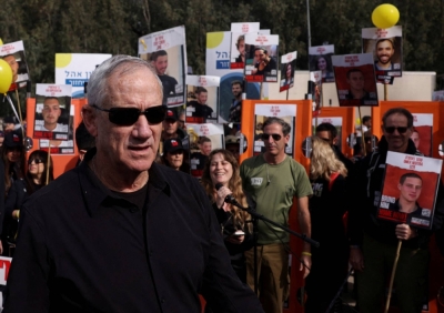 Israeli Defense Minister Benny Gantz walks as families and supporters of hostages kidnapped in the deadly Oct. 7 attack on Israel by the Palestinian Islamist group Hamas take part in a four-day march from Reim to Jerusalem as they call for the release of hostages, near Beit Shemesh, Israel, on March 1.