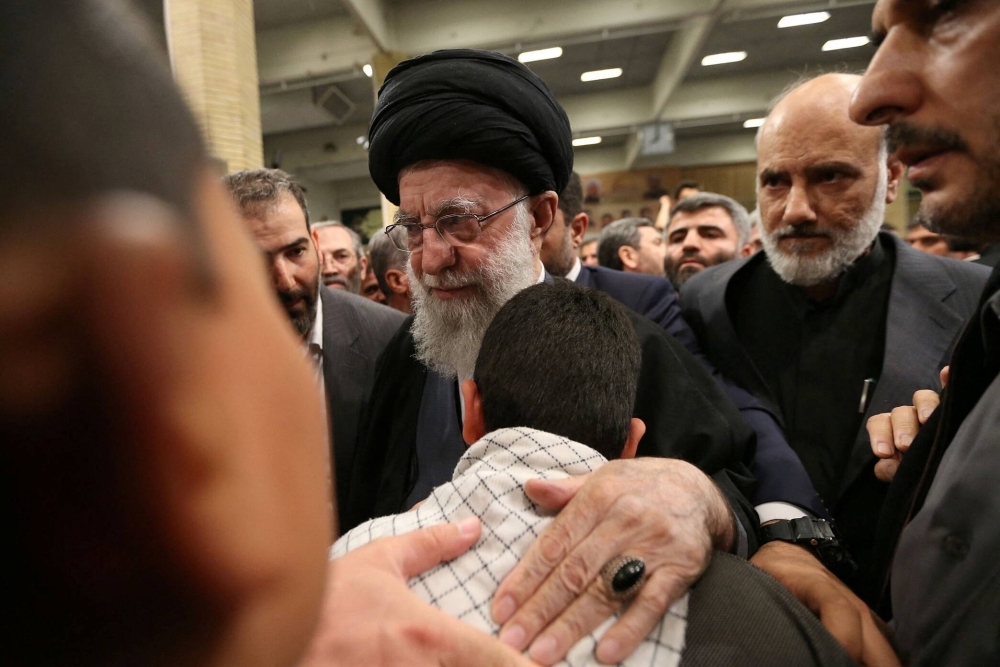 Iran's Supreme Leader, Ayatollah Ali Khamenei, meets with the family of one of the members of the Islamic Revolutionary Guard Corps who were killed in the Israeli airstrike on the Iranian embassy complex in the Syrian capital Damascus, during a funeral ceremony in Tehran on Thursday.