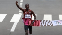 Eliud Kipchoge of Kenya crosses the finish line to win gold in the 2020 Tokyo Olympics men's marathon, in Sapporo in August 2021. | REUTERS