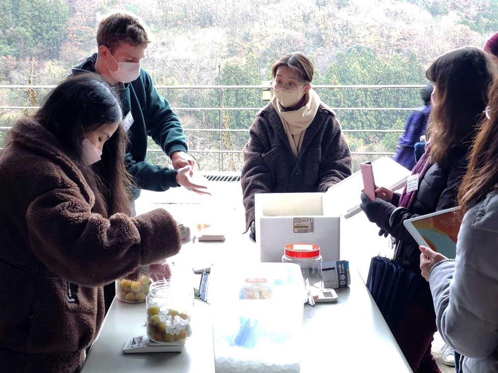 Members of the Community-Reactivating Cooperator Squad living in Tokushima Prefecture meet in the city of Yoshinogawa in the prefecture in December 2022 to learn from each other's experiences.