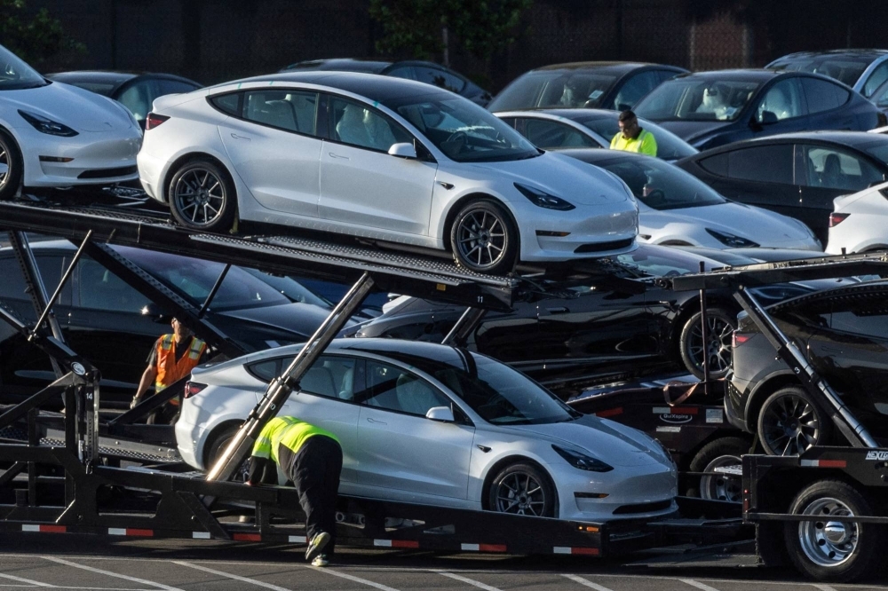 Tesla Model 3 vehicles are seen for sale at a Tesla facility in Fremont, California, last May.