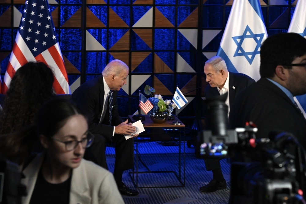 U.S. President Joe Biden meets with Israeli Prime Minister Benjamin Netanyahu in Israel amid the Israel-Hamas war, on Oct. 18. Despite growing pressure from Biden, the Israeli prime minister appears in no rush to end the war in Gaza. Some think he is dragging out the war to prevent the collapse of his fragile right-wing coalition and extend his time in office. 