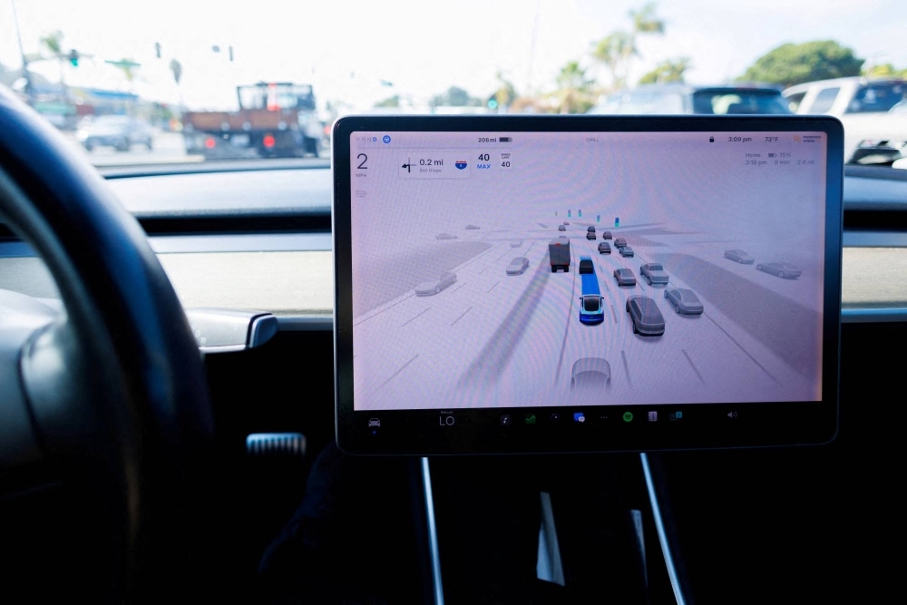 A Tesla Model 3 vehicle drives using FSD (Full Self-Driving) in Encinitas, California, in October.