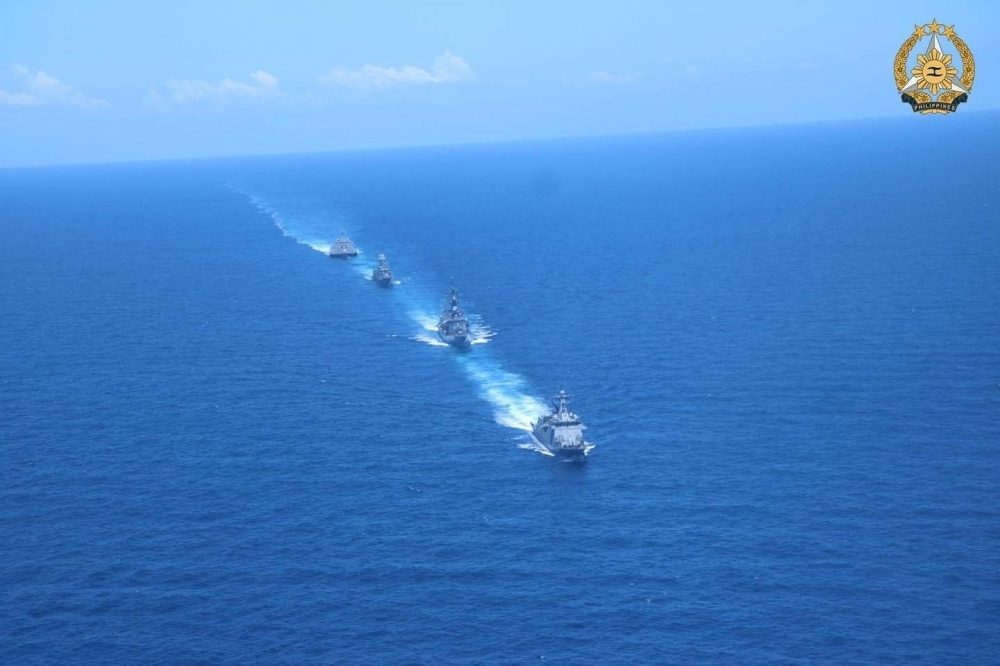Philippine, Australian, Japanese and U.S. warships take part in the four nations' first-ever joint military drills in the South China Sea on Sunday. 