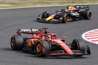 Ferrari driver Charles Leclerc (front) and Red Bull Racing's Max Verstappen during the Formula One Japanese Grand Prix in Suzuka, Mie Prefecture, on Sunday