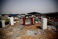 Broken fridges in the yard of a recycling workers' tenement house in Dongxiaokou village in Beijing in 2014 | REUTERS