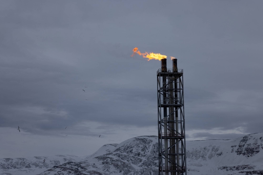 Flames blaze from a chimney at Western Europe's largest liquefied natural gas plant, Hammerfest LNG, in Hammerfest, Norway, on March 14.