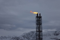 Flames blaze from a chimney at Western Europe's largest liquefied natural gas plant, Hammerfest LNG, in Hammerfest, Norway, on March 14. | REUTERS
