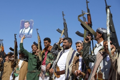 Houthi supporters hold up their rifles as they take part in a pro-Palestinian protest in Sanaa, Yemen, in February.