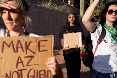 Protesters take part in a small rally led by Women's March Tucson after Arizona's Supreme Court revived a law dating to 1864 that bans abortion in virtually all instances, in Tucson, Arizona, on Monday.