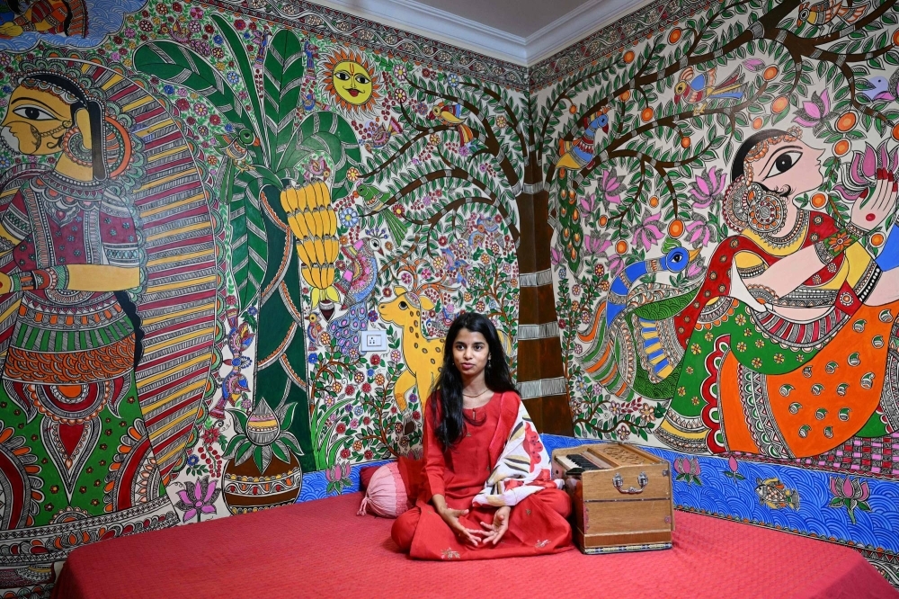 Indian folk singer Maithili Thakur speaks during an interview at her residence in New Delhi on April 2. Thakur thought she was successfull with millions following her Hindu devotional tunes on social media — but then Prime Minister Narendra Modi sent her popularity stratospheric.