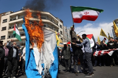 Iranians burn an Israeli flag in Tehran last week during a rally and a funeral for those who were killed in a suspected Israeli airstrike on the Iranian embassy complex in the Syrian capital Damascus.