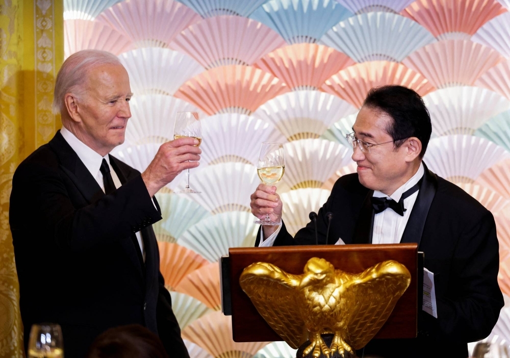U.S. President Joe Biden and Prime Minister Fumio Kishida toast during an official state dinner at the White House in Washington on Wednesday.