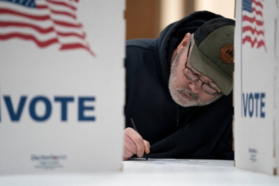 A Wisconsin resident prepares to vote in the presidential primary election in Superior, Wisconsin, on April 2.
