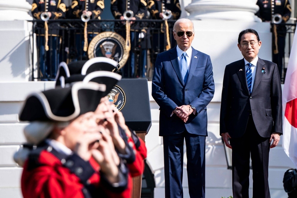 U.S. President Joe Biden and Prime Minister Fumio Kishida attend an an arrival ceremony as part of a state visit by Kishida, on the South Lawn of the White House in Washington on Wednesday. 