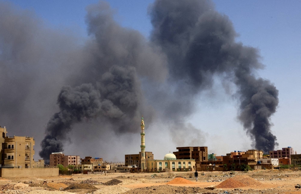 Smoke rising above buildings after an aerial bombardment in Khartoum North, Sudan, in May 2023
