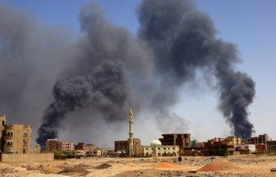 Smoke rising above buildings after an aerial bombardment in Khartoum North, Sudan, in May 2023