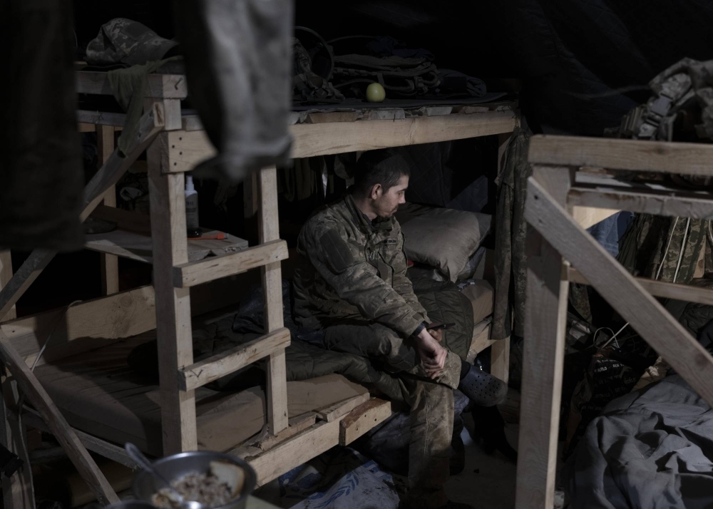 A soldier resting after returning from a front-line position in Ukraine’s Kharkiv region in November 2023.