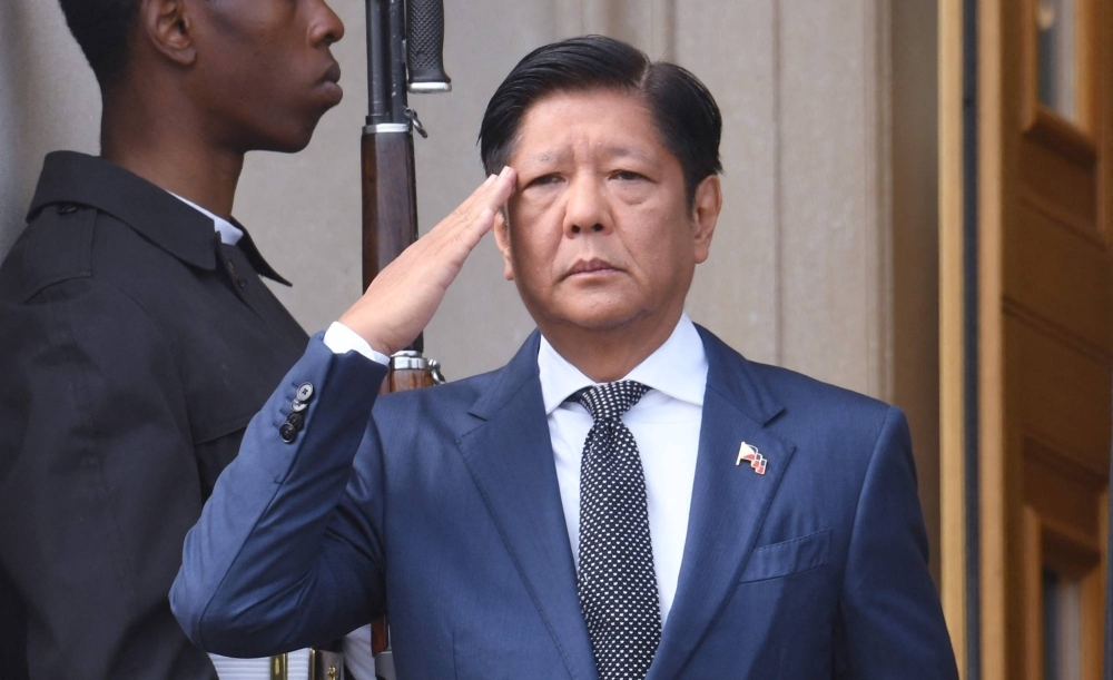 Philippine President Ferdinand Marcos Jr. salutes during a welcome ceremony at the Pentagon in Washington on Friday.