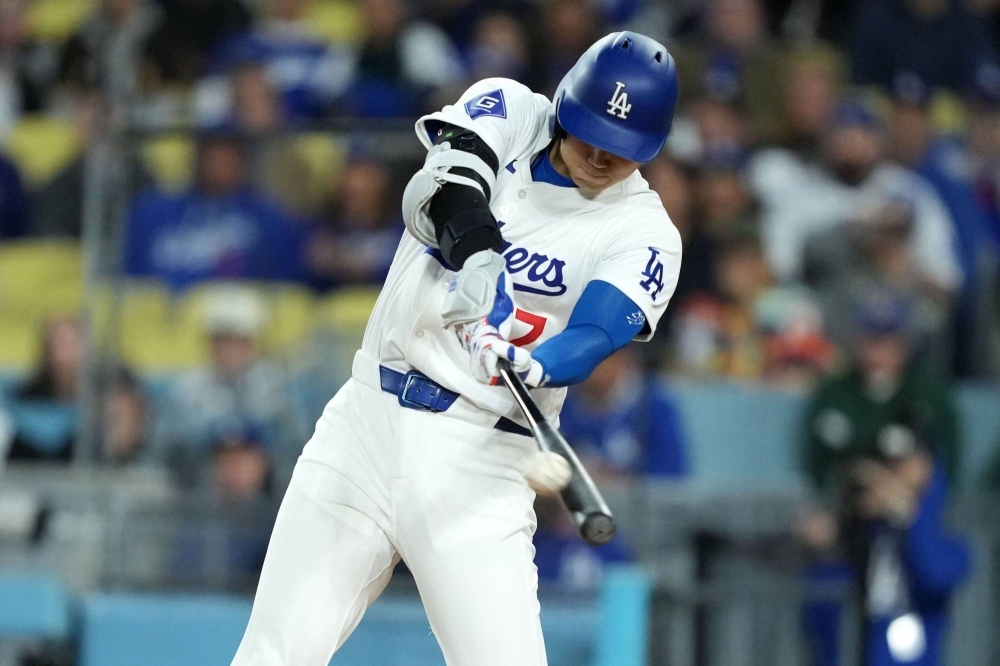 Dodgers designated hitter Shohei Ohtani hits a home run in the first inning against the Padres to equal Hideki Matsui for the most home runs by a Japanese-born player in MLB. 