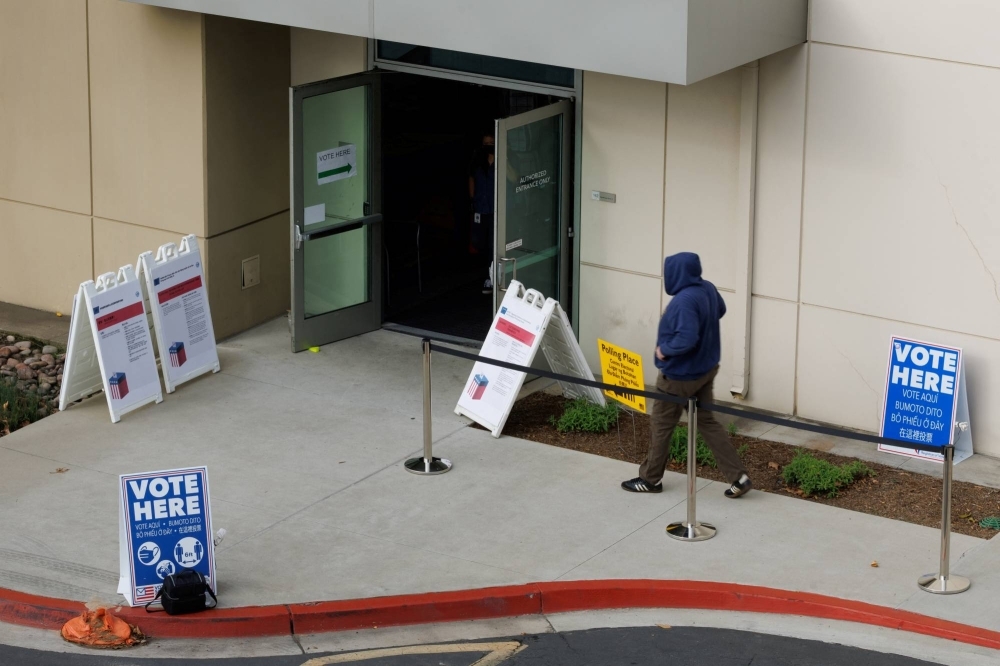 A voter arrives at a polling station in San Diego, California. According to a recent survey, young U.S. men were the only population group in the United States or seven EU member states actually to have become more conservative since 2014.